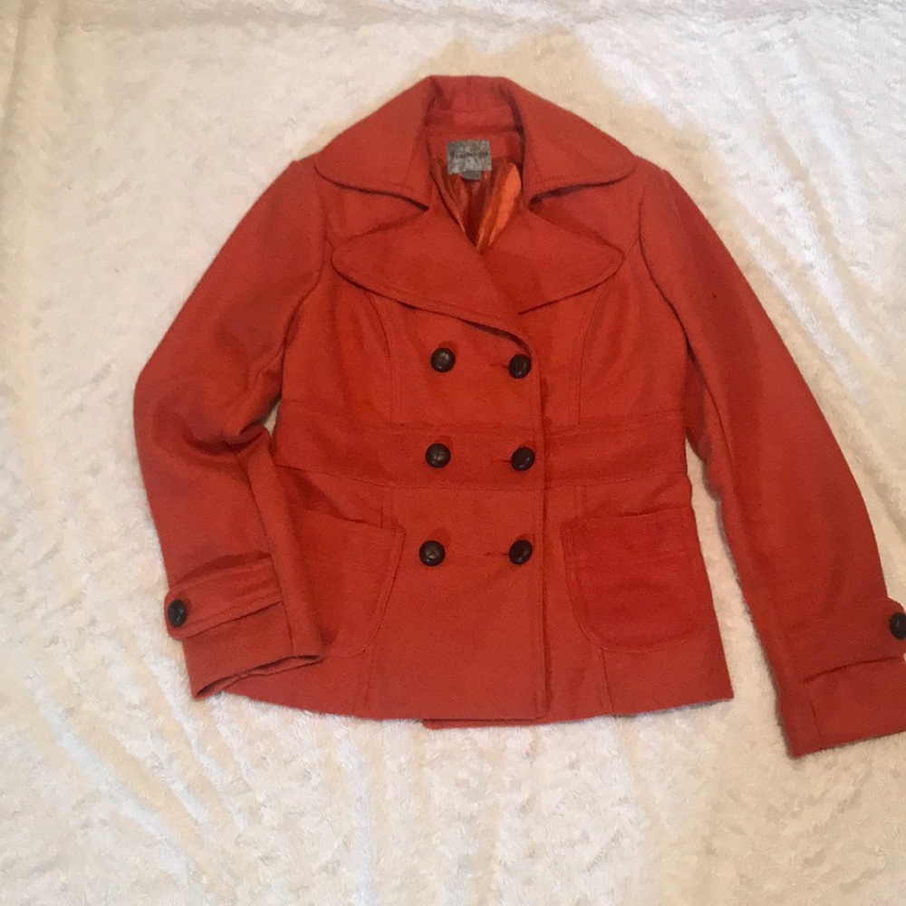 Orange coat.